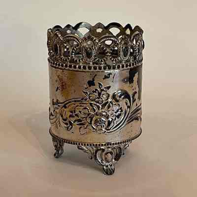 Silver plated toothpick holder with raised flower and pierced rim, 1890s