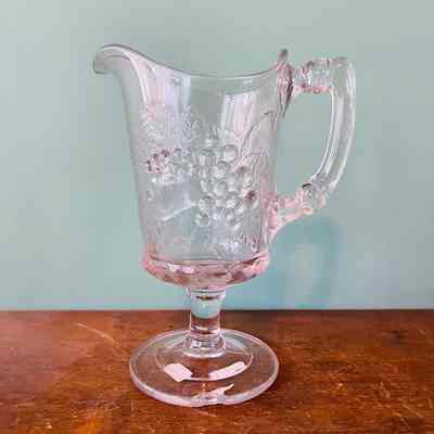 Clear glass pitcher in grape, pear and raspberry pattern, c. 1890