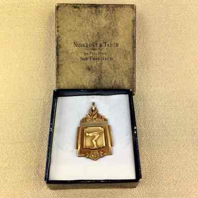 Gold plated medal awarded by Leo Purcell Swimming School, 1934