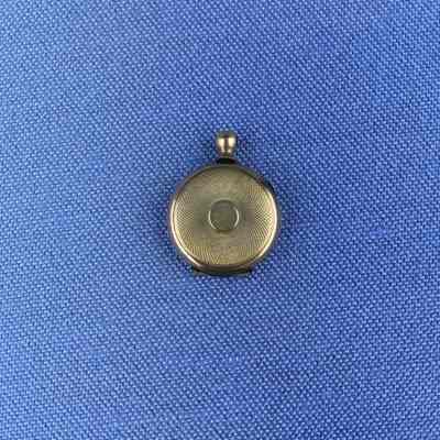Gold plated miniature locket of the Toye family, c. 1900
