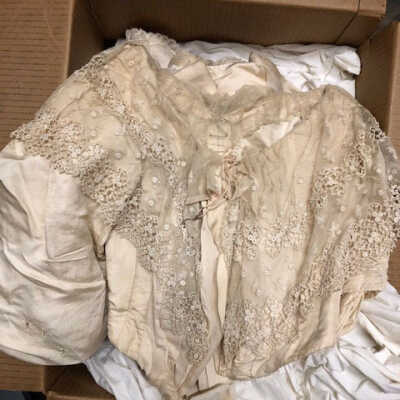 Two-piece dress of cream watered-silk, with puffed sleeves and lace trim, c. 1890s