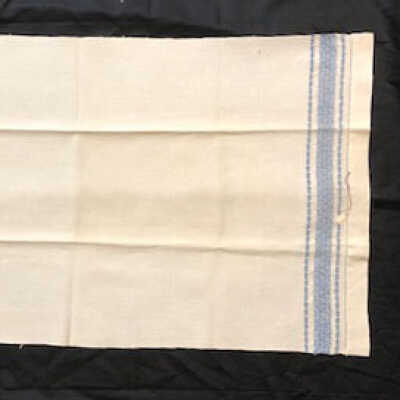 Heavy white linen guest towel with blue design at each end, 1900s-1920s