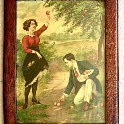 Framed print of a couple picking peaches, c. 1915