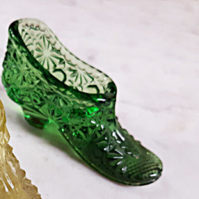 Dark green class slipper match holder of the Meyers family, prior 1997