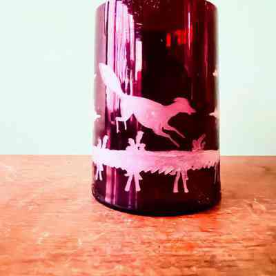 Ruby flashed glass mug with design of a dog, 1860s or 1870s