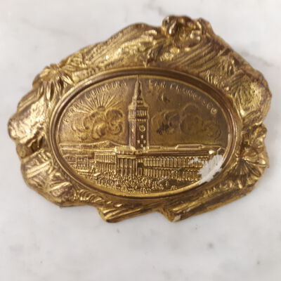 Souvenir metal paperweight depicting the S.F. Ferry Building, c. 1900