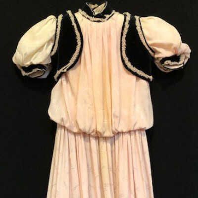 Pink silk child's dress with black velvet trim and black velvet jacket, 1905