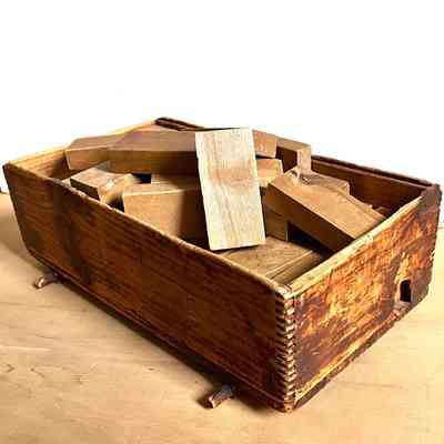 Wooden blocks in cart, c. 1920