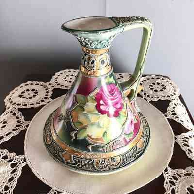 Nippon hand-painted pitcher with design of roses and enameling, early 1900s