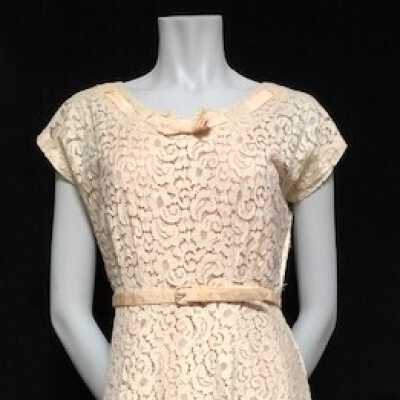 Semi-formal short sleeved lace dress of Adeline T. Cox, c. 1950s