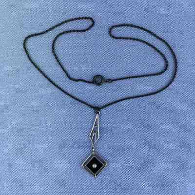 Chrome plated pendant with jet and seed pearl on silver plated chain, c. 1920