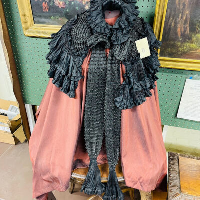Black silk demi cape with streamer ties of Sophia May, c. 1900