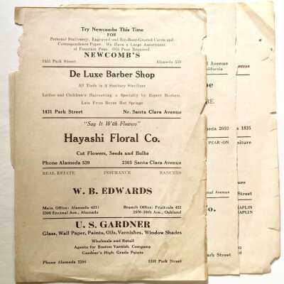 Pages with a directory listing of businesses, c. 1920s