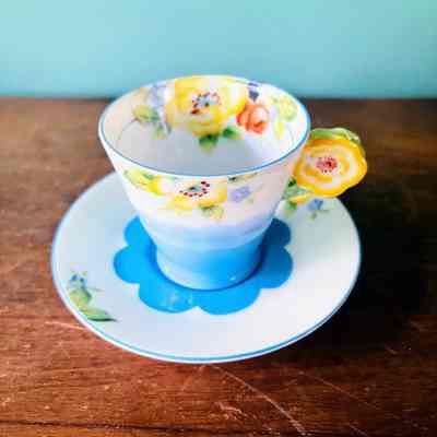 Noritake porcelain cup and saucer with yellow and blue flowers, c. 1950s