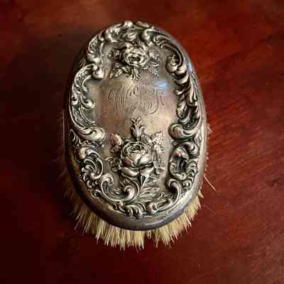 Silver clothing brush with roses of the Foster family, c. 1900
