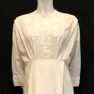 White cotton crepe full length dress with embroidered bodice and skirt, 1914
