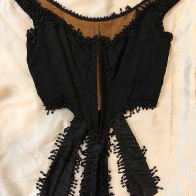 Ladies' black faille vest with stays and laces and black glass bead fringe, 1880s