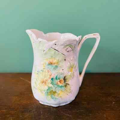 Porcelain pitcher with green flowers of the Meyers family, early 1900s