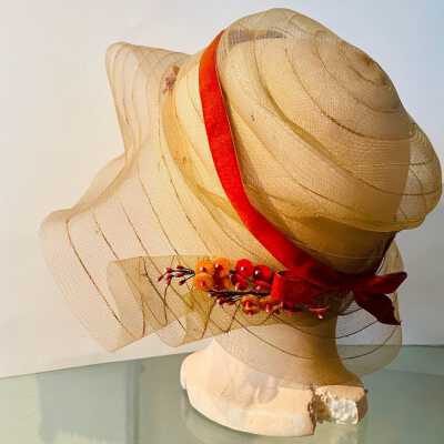 Horsehair hat trimmed with orange ribbon and bow and flowers, c. ealry 1930s