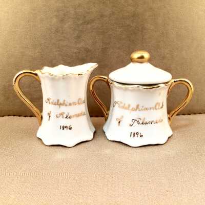 Miniature creamer and sugar container commemorating Adelphian Club founding, c. 1990s