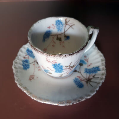 White gold-rimmed porcelain coffee cup & saucer with blue flowers, c. 1900