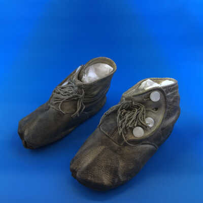 White kid high button baby shoes of the Cox family, c. 1920s