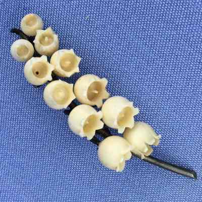 Carved ivory or bone lily of the valley brooch of Olive Toye, c. 1890s