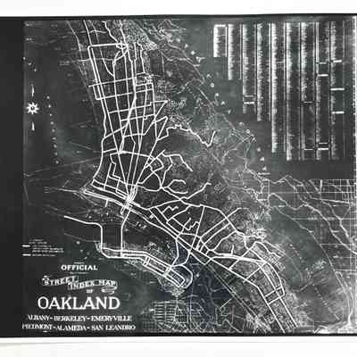 Photo and negative of a street index map with transportation lines