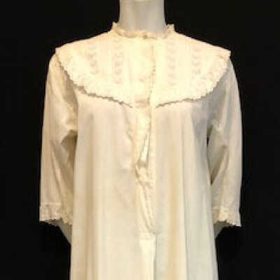 Full length white cotton nightgown with lace yoke and part bodice, c. 1890s-1900