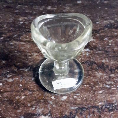 Pedestal base clear glass eye wash cup of the Meyers Home, prior 1997