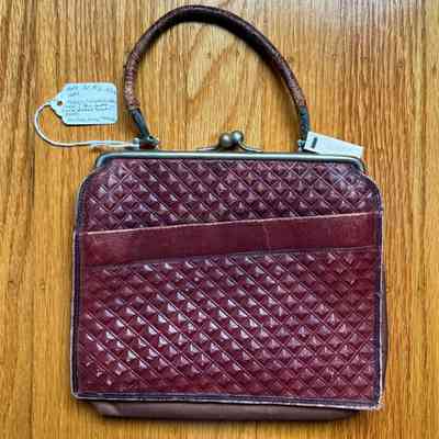 Maroon leather purse of Mrs. Sophia May, early 1900s