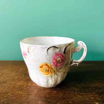 Gold-rimmed white porcelain Coffee cup & saucer with flowers, early 1900s