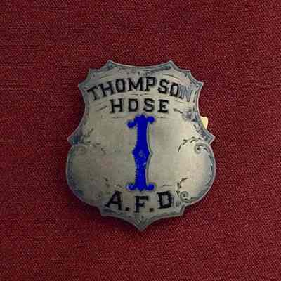 Silver plated Thompson Hose 1 badge with black and blue enameled lettering, c. 1890s