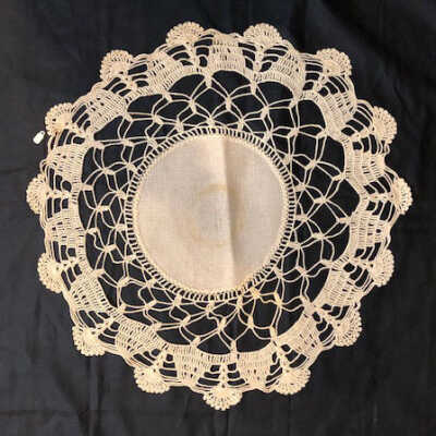 Circular doily with unbleached linen center and ecru lace edging, c. 1920s