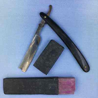 Jordan collapsible straight razor in black imitation leather traveling case, c. 1900
