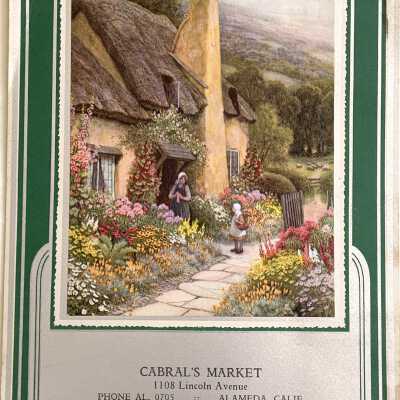 Wall calendar with English thatched cottage advertising Cabral's Market, 1936