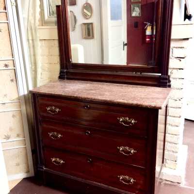 Three drawer bureau with marble top and tilting mirror, c. 1890s