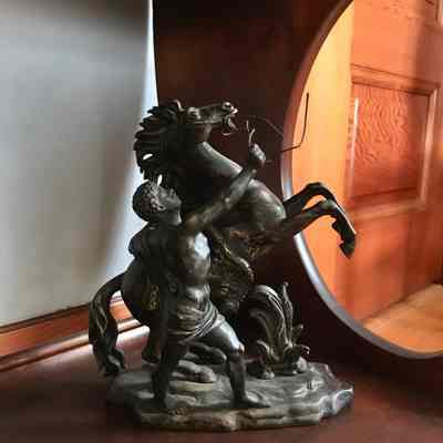 Statue of a rearing horse with trainer, c. 1890s