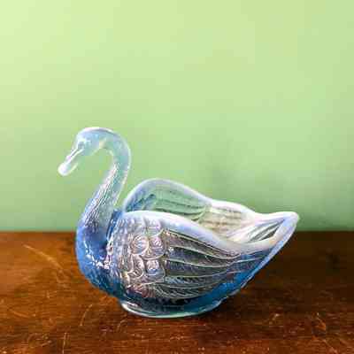 Blue pressed glass swan-shaped dish of the Cox family, c. 1930s