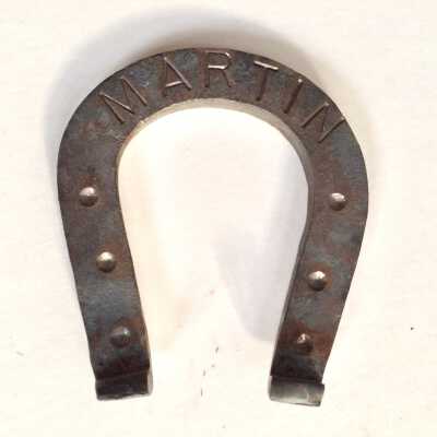 Horseshoe shaped iron nameplate of the Martin family, date unknown