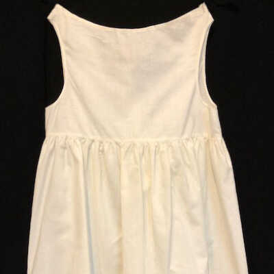 White cotton baby slip with crocheted lace flounce, c. 1890s-1900