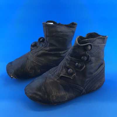 Black leather baby shoes with four buttons of Adeline T. Cox, late 1890s