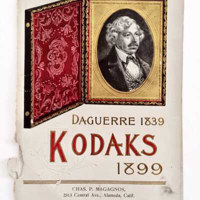 Booklet cover advertising Charles P. Magagnos Photo store, 1899