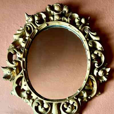 Oval mirror in gold finish rococo carved wood frame, c. 1950s