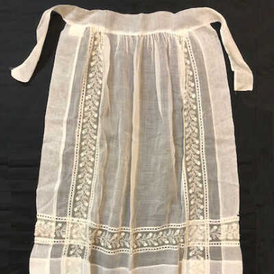 White cotton and lace ruffled half apron, c. 1900