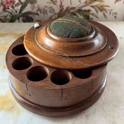 Circular walnut thread box from the Meyers family, c. 1880