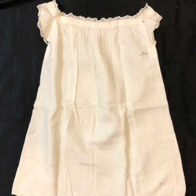 White cotton baby slip with ruffled sleeves, c. 1890s