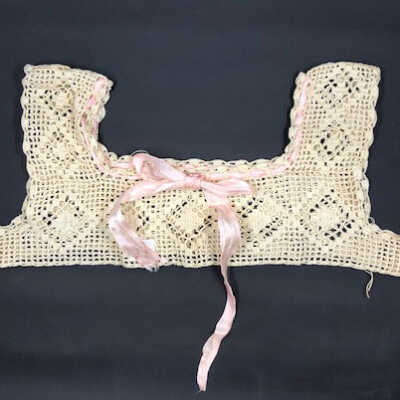 Sleeveless Hand-crocheted ecru slip or nightgown top with pink silk ribbon trim, c. 1920s