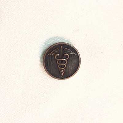 Bronze button insignia with Hippocratic Oath symbol from a uniform, 1941-1945