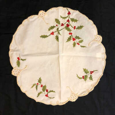 White circular table doily with embroidered holly, early 1900s